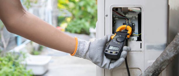Technician checking the operation of the air conditioner